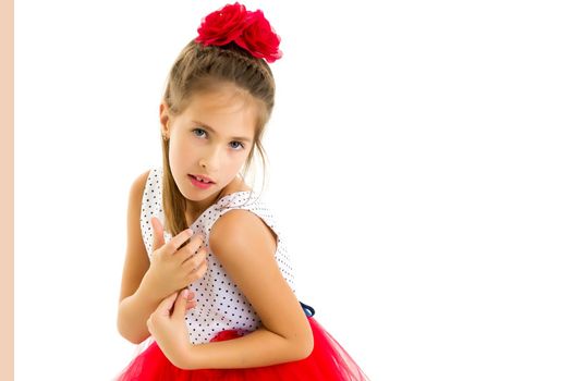 Beautiful little girl posing in the studio. Children's emotions concept. Close-up. Isolated on white background.