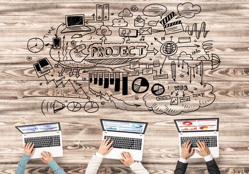Group of three people with devices in hands working together as symbol of networking and communication