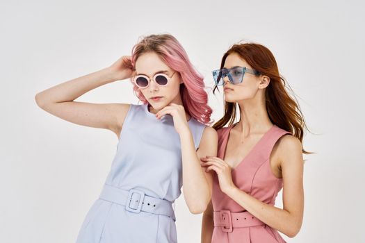 two women fashionable clothes posing accessories summer style. High quality photo