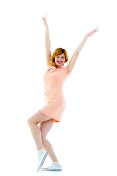 Beautiful young woman dancing merrily. Isolated on white background