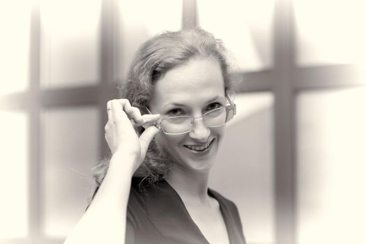 Beautiful young woman in glasses closeup. Style and fashion concept.