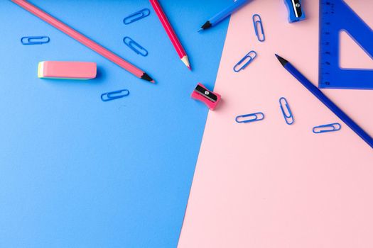 Back to school. Scattered stationery on paper background top view
