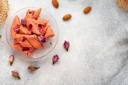 Close up photo of colorful Turkish halva sweets on gray surface