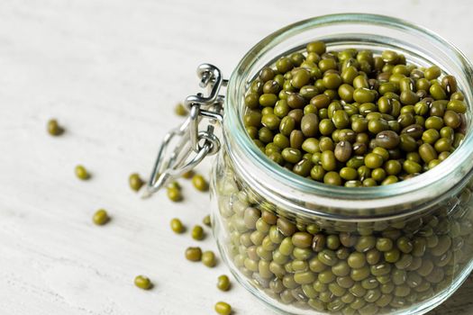 Raw cereals or beans in glass jars close up. Vegan and vegetarian food. Close up.