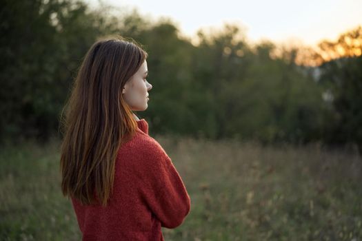 woman outdoors in a field walk fresh air. High quality photo