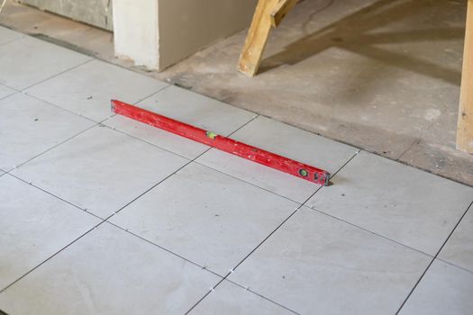 Close-up Installing tiles floor in construction work