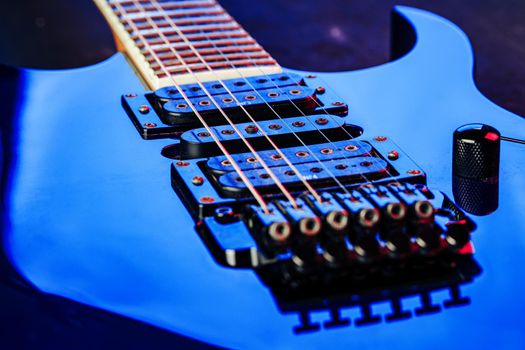 Electric guitar body in the dark close up shot