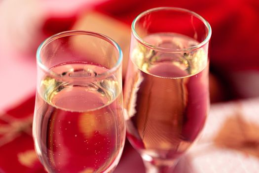 Close up photo of Champagne glasses against bokeh lights background