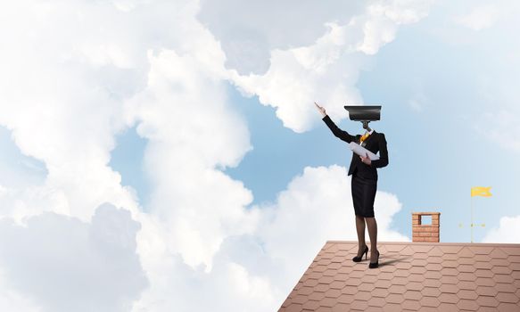 Faceless businesswoman with camera zoom instead of head standing on house roof