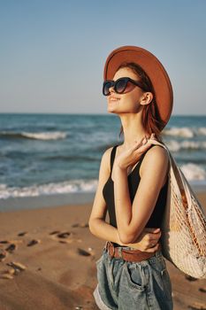woman walking on the beach landscape sun fun lifestyle. High quality photo