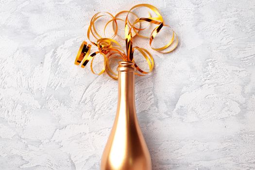 Champagne bottle with streamers flat lay top view, Christmas background