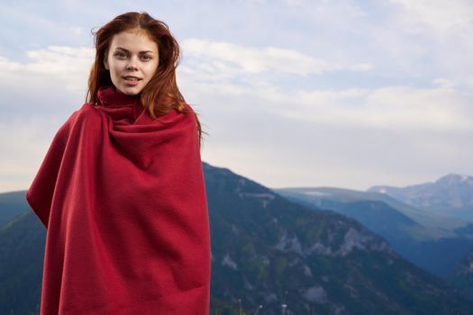 woman with red plaid on nature in the mountains vacation adventure. High quality photo