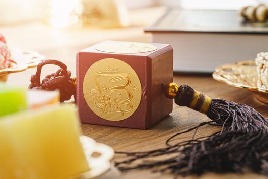 Oriental religious beads close up on a wooden table with coffee