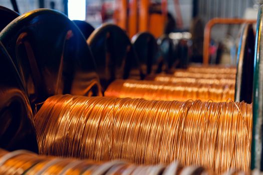 Production of copper wire, cable in reels at factory. Cable factory. Close up.