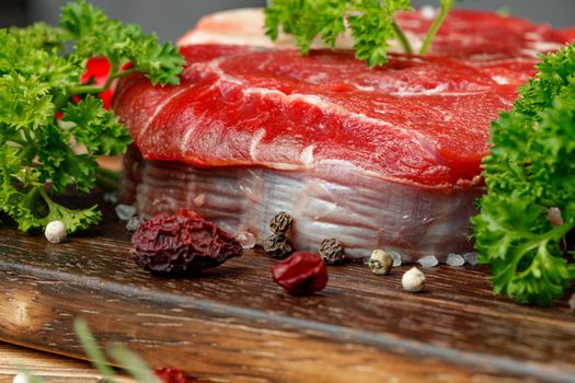 Raw meat slice for grill with seasoning, close up