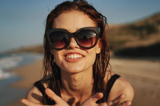 pretty woman in black swimsuit beach nature sun. High quality photo