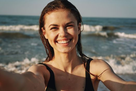 woman in black swimsuit sunglasses sun nature. High quality photo