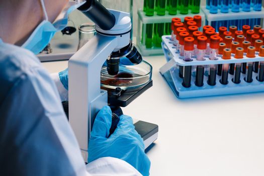 Hands of a laboratory worker doing blood test, close up