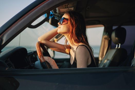 woman driving in car trip posing fashion travel. High quality photo