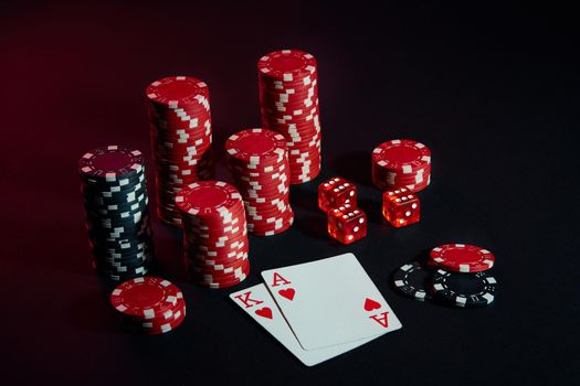 Stack of chips and two cards on dark background - poker game concept. Still life. Copy space. Poker Online. Cards - Ace and King