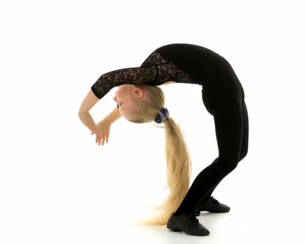 A gymnast girl prepares for the exercise. The concept of childhood and sport, a healthy lifestyle. Isolated on white background.