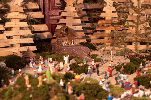 Christmas scene with small Jesus Creche and the city around