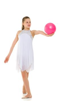 Beautiful little girl gymnast performs exercises with the ball. The concept of children's sports, fitness. Isolated on white background.