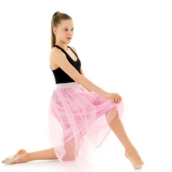 Graceful Girl Gymnast Performing Rhythmic Gymnastics Exercise, Sportive Girl Dancing Wearing Sport Dress, Beautiful Long Haired Teenager Posing in Studio Against White Background