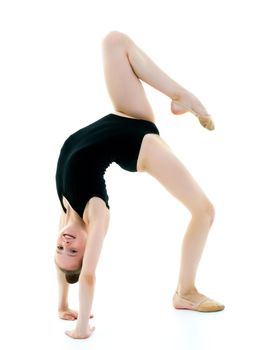 Girl gymnast performs a bridge. The concept of childhood, sport, healthy lifestyle. Isolated on white background.