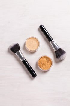 Mineral face powder and brush. Eco-friendly and organic beauty products.