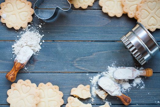 Background of baking gluten free shortbread cookies with utensils and ingredients, viewed from above