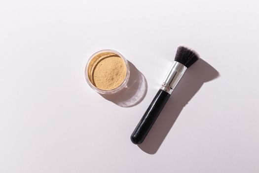 Mineral face powder and brush. Eco-friendly and organic beauty products.