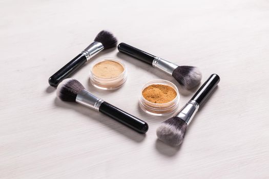 Mineral face powder and brush. Eco-friendly and organic beauty products.