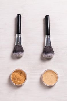 Mineral face powder and brush. Eco-friendly and organic beauty products.