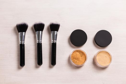 Mineral face powder and brush. Eco-friendly and organic beauty products.