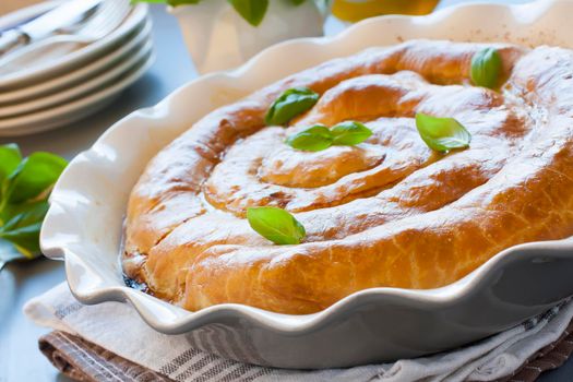 Meat strudel. Traditional Moldavian and Romanian snail-shaped pie.