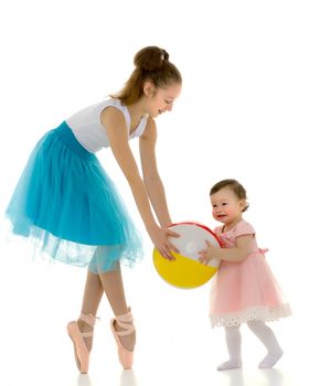 Graceful Ballerina Playing Ball with Adorable Smiling Toddler Girl, Teenage Girl in Blue Skirt, Leotard and Ballet Shoes Standing on Toes, Lovely Children Having Fun on Isolated on White Background