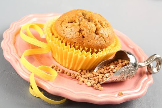 Freshly baked buckwheat muffins on the rose plate