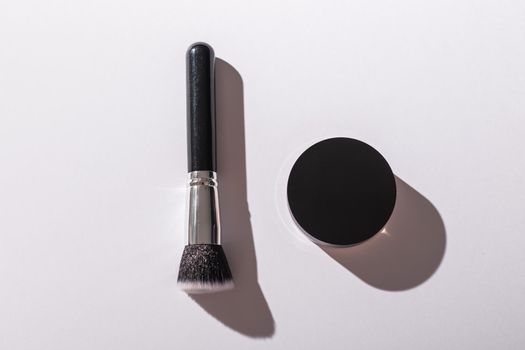 Mineral face powder and brush. Eco-friendly and organic beauty products.