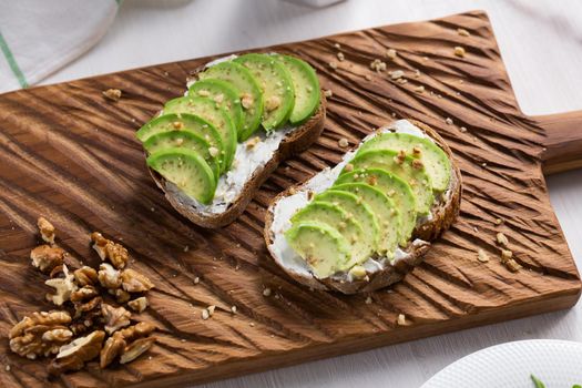 sliced avocado on toast bread with spices.