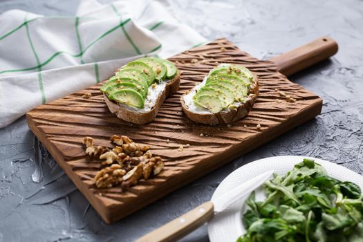 sliced avocado on toast bread with spices.