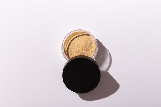Mineral powder foundation isolated on a white background. Eco-friendly and organic beauty products.