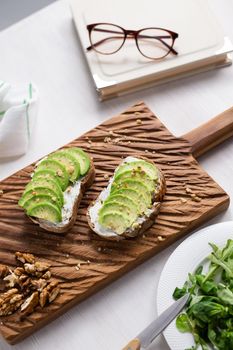 sliced avocado on toast bread with spices.