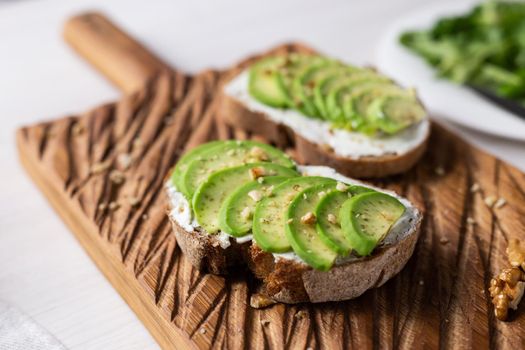 sliced avocado on toast bread with spices.