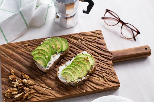 sliced avocado on toast bread with spices.