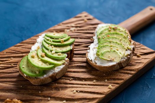 sliced avocado on toast bread with spices.