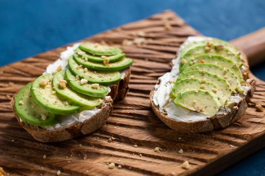 sliced avocado on toast bread with spices.