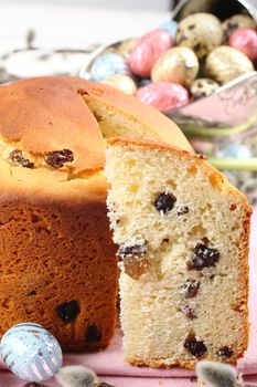 Easter bread and colorful eggs on white background