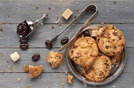 Chocolate candy with chocolate chip cookies on wooden background