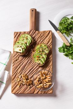 sliced avocado on toast bread with spices.